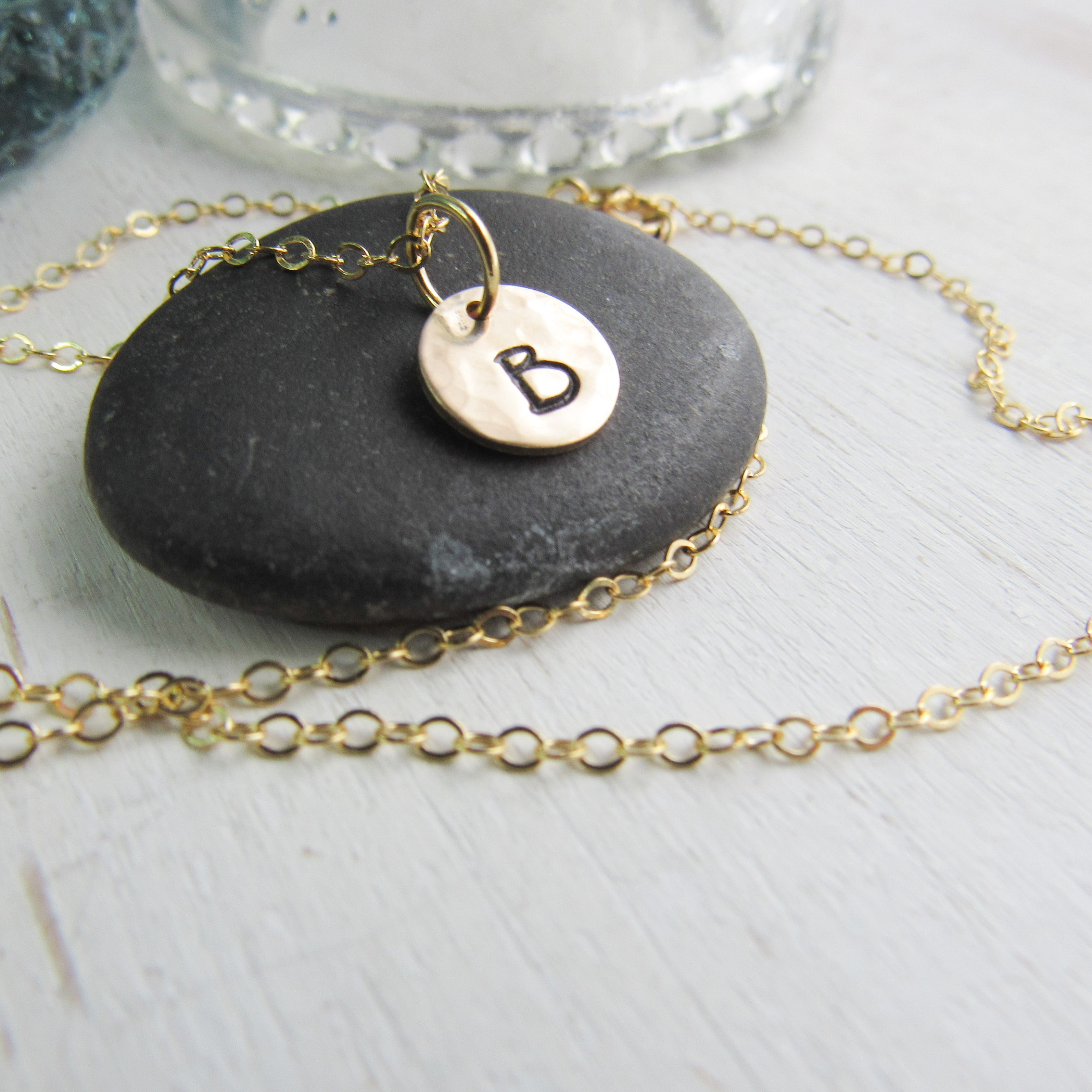 14K Gold filled keepsake charm necklace. Small charms are textured and stamped with the letters that mean the most to your heart. 